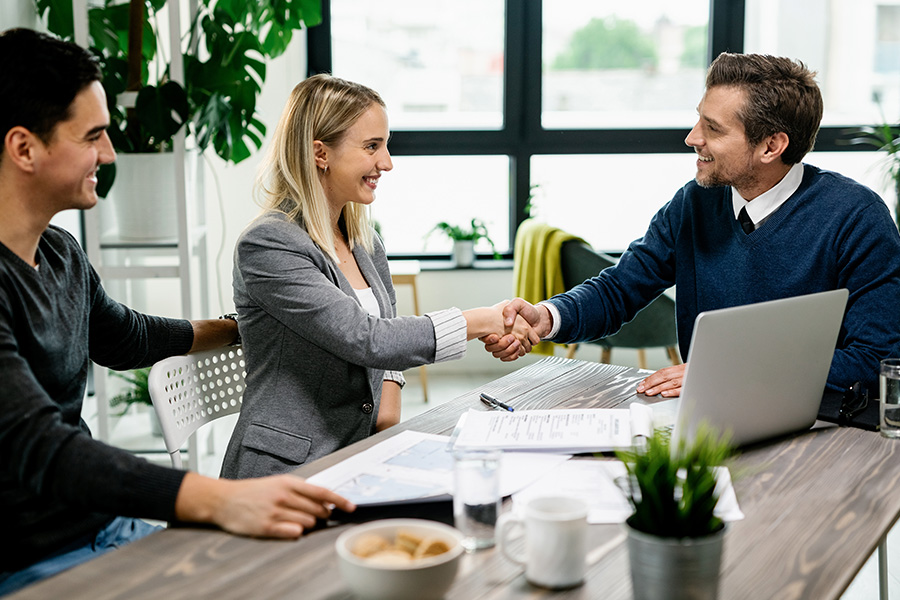 Specialized Business Insurance - Shaking Hands With Client After Making a Deal